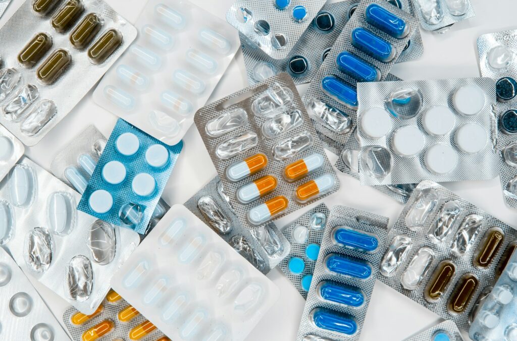Pharmacy shelves with stocked medication