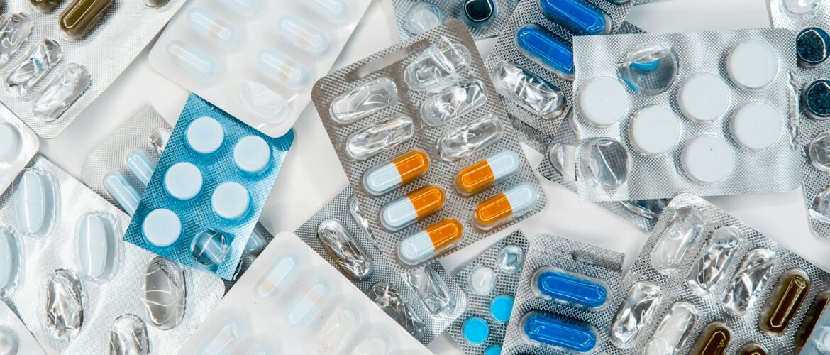 Pharmacy shelves with stocked medication