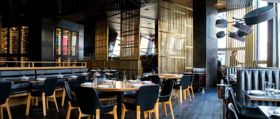 Modern restaurant interior with set tables